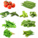 Assorted-green-vegetables-including-tomatoes-beans-cucumbers-and-okra-on-a-white-background