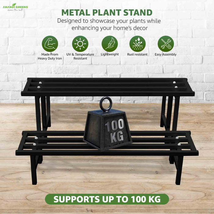 Metal plant stand with a 100 kg weight on a wooden surface, featuring Anandi Greens branding.