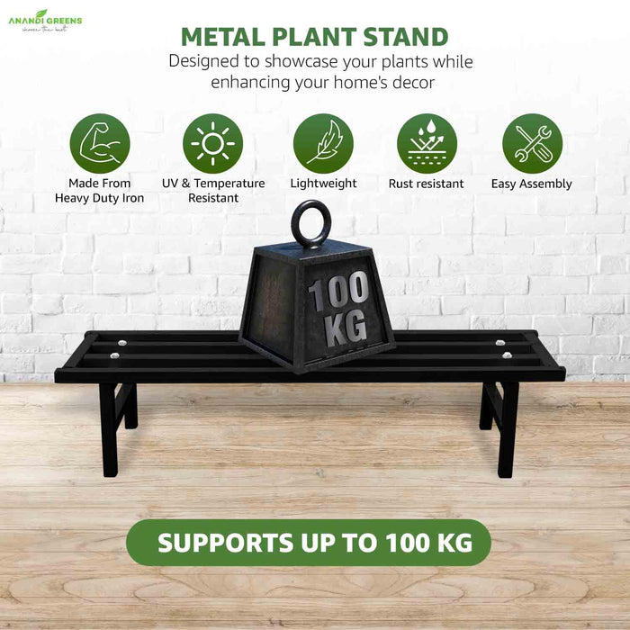 Metal plant stand with 100 kg weight on a wooden floor against a white brick wall.