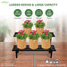 Black metal plant stand with pots of flowers labeled for different rooms, featuring 'Anandi Greens' branding.
