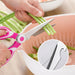 cutting vegetables with stainless steel kitchen scissors sharp blade close up