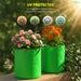 Two green UV-protected fabric pots with flowers on a garden background.