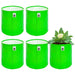 Four green fabric pots with a plant inside on a white background