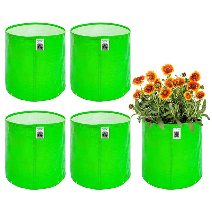 Four green fabric planters with a fifth containing flowers on a white background