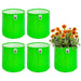 Four green fabric planters with a fifth containing flowers on a white background