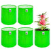 Four green Grow Bag fabric planters with a plant in one of them on a white background