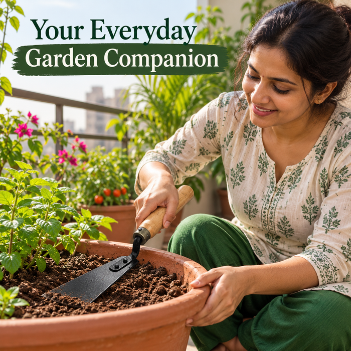 Gardener using Anandi Greens khurpee in a balcony planter